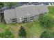 Aerial view of a multi-unit residential building showcasing its rear facade and surrounding landscaping at 164 Reserve Cir # 208, Oviedo, FL 32765