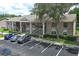 This exterior shows the building in the community and parking at 164 Reserve Cir # 208, Oviedo, FL 32765
