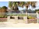 Outdoor grilling area with brick surround and two grills, perfect for community gatherings at 164 Reserve Cir # 208, Oviedo, FL 32765