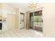 Kitchen eating area includes washer/dryer hookups and access to screened porch at 164 Reserve Cir # 208, Oviedo, FL 32765
