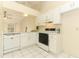 Bright kitchen featuring white cabinetry, tile floors, modern appliances, and natural light at 164 Reserve Cir # 208, Oviedo, FL 32765