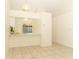 Living area with tile floors, open bar to kitchen, and bright, airy atmosphere at 164 Reserve Cir # 208, Oviedo, FL 32765