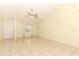 Open living area with neutral tile flooring, a ceiling fan, and bright, airy atmosphere at 164 Reserve Cir # 208, Oviedo, FL 32765