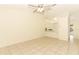 Comfortable living room with tile flooring, ceiling fan, and an open view to the kitchen area at 164 Reserve Cir # 208, Oviedo, FL 32765
