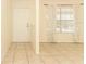 Inviting living room with neutral tile floors, a large window, and ample natural light at 164 Reserve Cir # 208, Oviedo, FL 32765