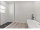 Modern bathroom with free standing tub and glass enclosed shower at 17046 Sw 44Th Cir, Ocala, FL 34473
