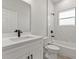 Bright bathroom with white marble tile and modern fixtures, including a sleek faucet and shower head at 17046 Sw 44Th Cir, Ocala, FL 34473