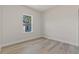 This bedroom has bright natural lighting and wood-look flooring at 17046 Sw 44Th Cir, Ocala, FL 34473
