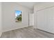 This bedroom has a closet and wood-look flooring at 17046 Sw 44Th Cir, Ocala, FL 34473