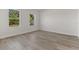 Bright bedroom with light wood floors and neutral paint, offering a versatile space for rest and relaxation at 17046 Sw 44Th Cir, Ocala, FL 34473