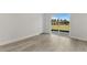 Bright bedroom featuring a sliding glass door and hardwood floors at 17046 Sw 44Th Cir, Ocala, FL 34473