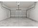 This garage features an automatic garage door and concrete floor at 17046 Sw 44Th Cir, Ocala, FL 34473