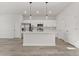 Modern kitchen features stainless appliances, shaker cabinets, and an island, perfect for cooking at 17046 Sw 44Th Cir, Ocala, FL 34473