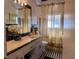 Bathroom featuring black and white tile floor, vanity, and shower at 202 S Hampton Ave, Orlando, FL 32803