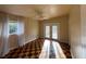 Sunny bedroom features a ceiling fan, checkered flooring, natural light and glass doors to deck at 202 S Hampton Ave, Orlando, FL 32803