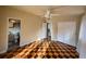 Bedroom featuring checkered floors, closet space, ensuite bathroom, neutral paint and ceiling fan at 202 S Hampton Ave, Orlando, FL 32803