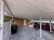 Spacious carport providing covered parking and featuring ample room for vehicle and storage at 202 S Hampton Ave, Orlando, FL 32803