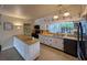 The kitchen features white cabinets, butcher block countertops, and stainless steel appliances at 202 S Hampton Ave, Orlando, FL 32803