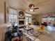Sunlit living room with a white brick fireplace and plenty of seating at 202 S Hampton Ave, Orlando, FL 32803