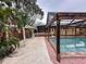 Backyard pool with screened enclosure, connecting to the house and featuring a serene outdoor space at 202 S Hampton Ave, Orlando, FL 32803