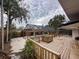 Backyard pool with a screened enclosure, complemented by a patio area and wooden deck at 202 S Hampton Ave, Orlando, FL 32803