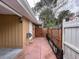 Side yard featuring access to the back yard and a secure privacy fence at 202 S Hampton Ave, Orlando, FL 32803