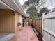 Side yard featuring access to the back yard and a secure privacy fence at 202 S Hampton Ave, Orlando, FL 32803
