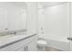 A clean and bright bathroom featuring a shower and tub combination at 2094 Rosewood Dr, Bartow, FL 33830