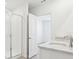 Modern bathroom with double sinks, granite counters, and a glass shower at 2094 Rosewood Dr, Bartow, FL 33830