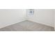 Cozy bedroom with a window, soft gray carpet, and white trim at 2094 Rosewood Dr, Bartow, FL 33830
