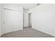A bedroom with neutral carpet and a double-door closet at 2094 Rosewood Dr, Bartow, FL 33830