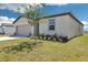 Charming single-story home featuring a well-manicured lawn and landscaping at 2094 Rosewood Dr, Bartow, FL 33830