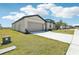 Charming single-Gathering home featuring an attached two-car garage and well-maintained lawn in a quiet neighborhood at 2094 Rosewood Dr, Bartow, FL 33830