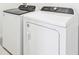 Modern laundry area featuring brand new white Whirlpool washing machine and dryer units at 2094 Rosewood Dr, Bartow, FL 33830