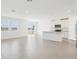 Open-concept living space with a modern kitchen, tile floors, and natural light at 2094 Rosewood Dr, Bartow, FL 33830