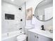 Modern bathroom features sleek black fixtures, stylish geometric tile accents, and a white vanity at 2411 Crawford Dr, Sanford, FL 32771