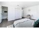 Cozy bedroom featuring hardwood floors, a soft rug, and access to a modern en-suite bathroom at 2411 Crawford Dr, Sanford, FL 32771