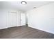 Spacious bedroom featuring wood floors, natural light, and closet space, providing a comfortable living area at 2411 Crawford Dr, Sanford, FL 32771