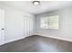Cozy bedroom with wood floors, a bright window, and a closet, designed for comfort and relaxation at 2411 Crawford Dr, Sanford, FL 32771