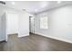 Bright bedroom with hardwood floors, large window, and a closet at 2411 Crawford Dr, Sanford, FL 32771