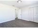 Bright bedroom with wood floors, a doorway, and a closet, offering a tranquil space for rest and relaxation at 2411 Crawford Dr, Sanford, FL 32771