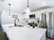 Modern kitchen featuring stainless steel appliances, a center island, and white countertops for cooking at 2411 Crawford Dr, Sanford, FL 32771