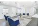 Inviting living room with ample natural light, a comfortable sofa, and stylish furnishings at 2411 Crawford Dr, Sanford, FL 32771