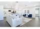 Open floor plan showing the kitchen and living room areas with modern interior design at 2411 Crawford Dr, Sanford, FL 32771