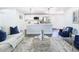 Bright living room with modern decor, an open kitchen, stainless steel appliances, and hardwood floors at 2411 Crawford Dr, Sanford, FL 32771