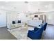 Bright living room featuring an open-concept design with modern furnishings and stainless steel appliances at 2411 Crawford Dr, Sanford, FL 32771