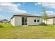 A spacious backyard with lush green grass is perfect for outdoor activities at 2511 Linda Knoll Ln, Bartow, FL 33830