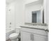 A well-lit bathroom features a vanity with granite countertop and a shower-tub combo at 2511 Linda Knoll Ln, Bartow, FL 33830