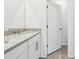 Bathroom featuring double sink vanity with granite countertop, white cabinets, and modern fixtures at 2511 Linda Knoll Ln, Bartow, FL 33830