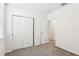 Cozy bedroom with plush carpeting, closet with sliding doors, and neutral paint, offering a relaxing space at 2511 Linda Knoll Ln, Bartow, FL 33830